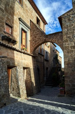  Cobbled street with stone buildings in Bagnoregio, Italy