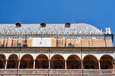 Detail of the facade with the colonnade of the medieval market hall Palazzo della Ragione in the city of Padua, Italy