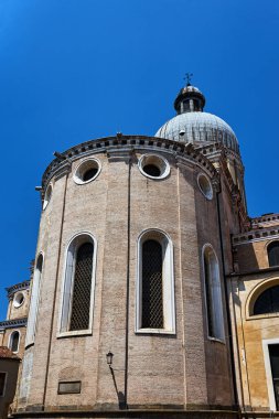 semicircular apse of a historic church with oblong windows in the city of Padua, Italy