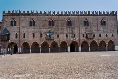 historic brick building with portico and windows, Palazzo del Capitano in the city of Mantua, Italy