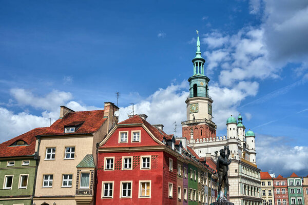 Historic tenement houses, a statue of Apollo and the tower of the Renaissance town hall on the market square in Poznan, Poland
