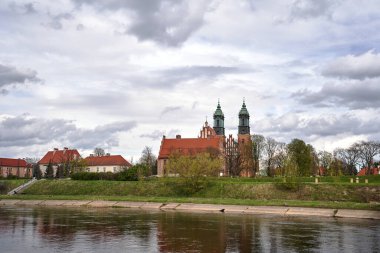 Historic buildings and towers of the cathedral on the river Warta in the city of Poznan, Poland