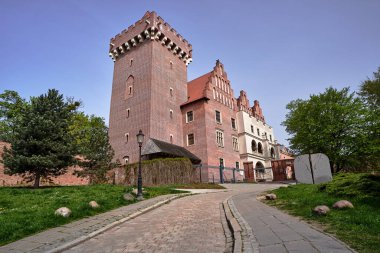 paved road to the reconstructed historic royal castle   in Poznan, Poland