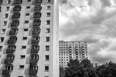 The facade  with balconies of a residential high-rise buildings in Poznan, Poland,  monochrome