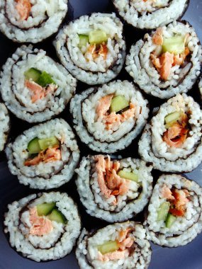 sushi rolls with salmon and cucumber clipart