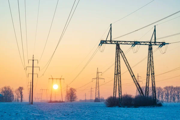 Ukraine electricity grid in winter time. Power line pylons in cold winter morning. Illustration of blackout risk in Ukraine