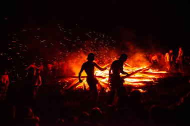 2019-07-06 Shipit, Ukraine. People dancing around the bonfire at annual Shipit hippie festival
