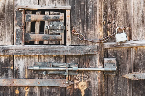 stock image Wintage door locks on wooden rustic door