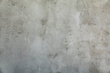 Beton alçı duvar dokusu. Üzerinde çizikler olan gri beton duvar..