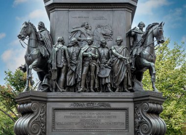 Bronze figures at the base of the monument to Frederick the Great on Unter den Linden, Berlin, Germany