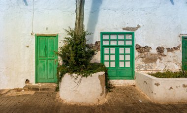 Facade detail, doors and windows on residential houses in Teguise, Lanzarote, Canary Islands, Spain