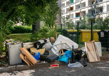 pollution from domestic waste dumped on public street land, potsdam, germany