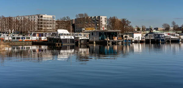 Jetty with houseboats and motor yachts at the pier in Spandau, Berlin, Germany