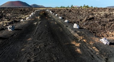 white villa in the black volcanic landscape, Lanzarote, Canary Islands, Spain