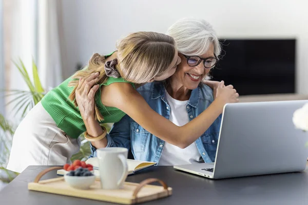 Shot Happy Granmother Using Laptop Her Granddaughter Home — Fotografia de Stock