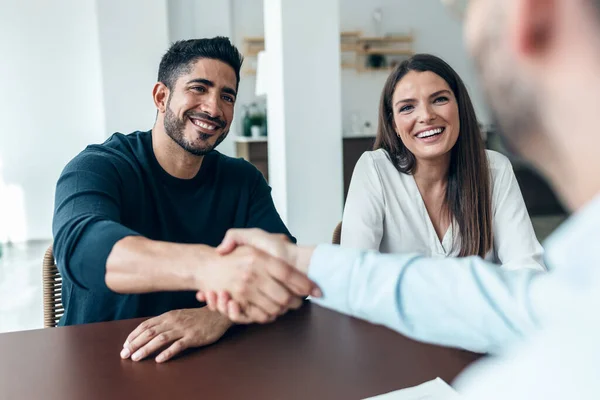 Shot Attractive Real Estate Agent Shaking Hands Young Couple Signing — Stock Photo, Image