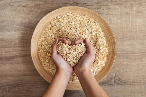 Close Woman Holding Heart Shaped Hands Oatmeal Wooden Bowl Kitchen — Stock Photo, Image