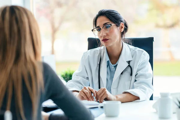 Shot Beautiful Cheerful Female Doctor Talking While Explaining Medical Treatment | Stock Photo