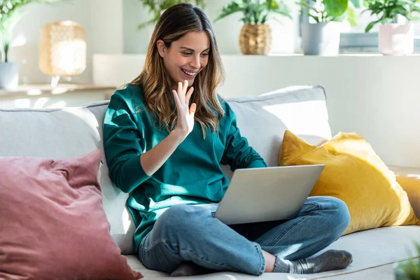 Shot Cute Woman Having Videocall Friends Laptop Sitting Couch Home — Stock Photo, Image