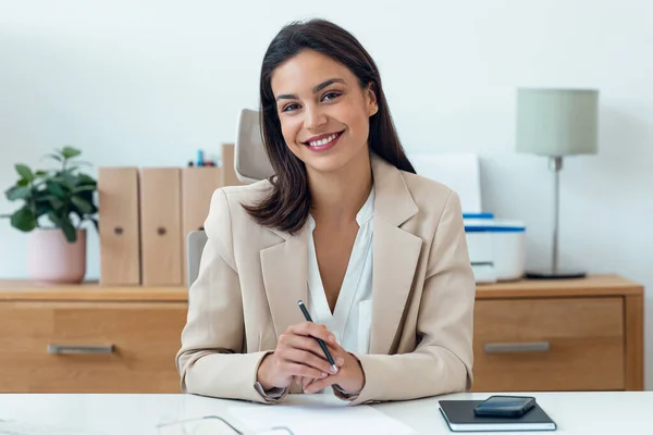 stock image Shot of beautiful elegant businesswoman doing video call while working in the office