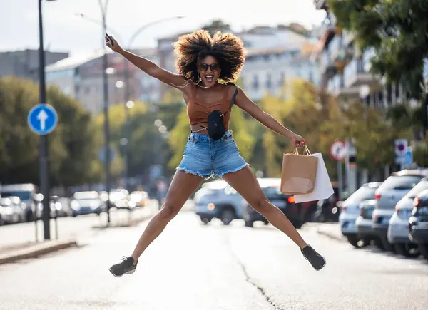 Shot Funny Crazy Woman Jumping While Holding Smartphone Crossing Street — Stock fotografie
