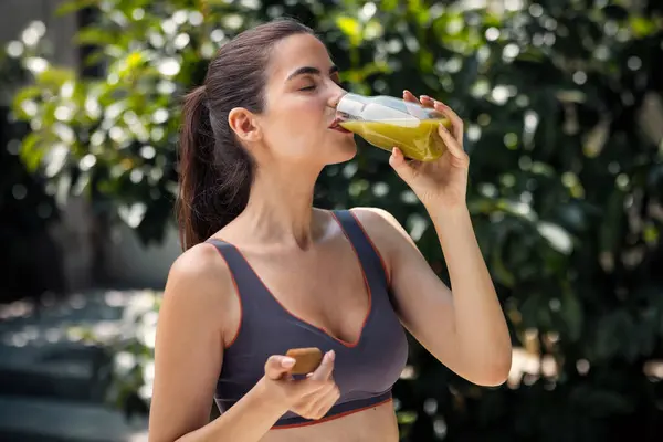 stock image Shot of helthy young woman drinking detox juice in the garden