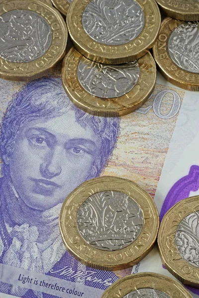 在特写镜头中使用了一磅英镑的英镑英镑英镑英镑 在一张两英镑的钞票上作为背景 — 图库照片