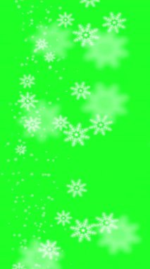 Dikey yeşil bir videoda kar taneleri