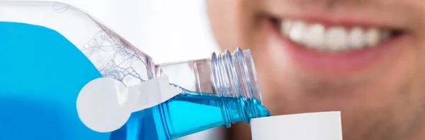 Healthy Mouthwash Rinse. Man Washing Mouth With Antiseptic Liquid