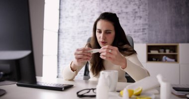 Sick Office Worker With Flu. Employee At Desk With Cold