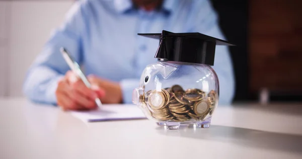 Piggy Bank With School Education Budget. Graduate Loan