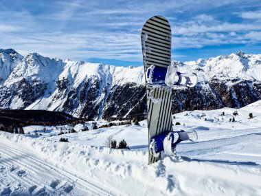 Snowboard In Snow At Mountains. Winter Sport