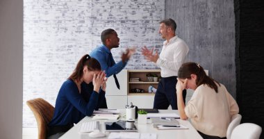 Angry Dominant Colleague Fighting And Bullying At Workplace
