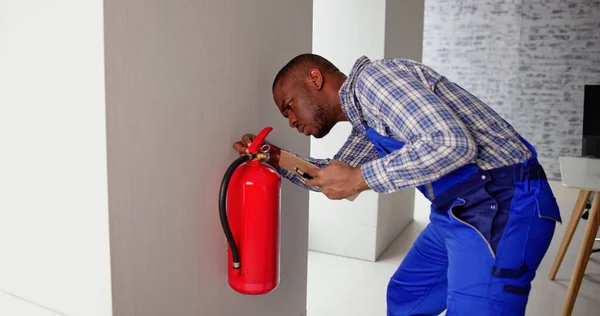 Checking Fire Extinguisher Safety Emergency Prevention — Stock Photo, Image