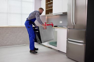 Oven Repair Technician. Appliance Maintenance Service And Installation