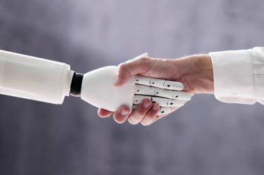 AI Robot Digital Machine And Man Hand Handshake