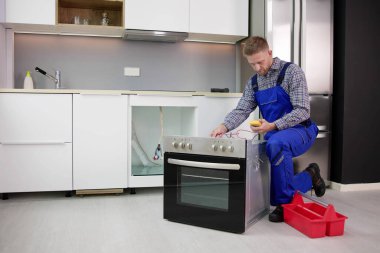 Oven Repair Technician. Appliance Maintenance Service And Installation