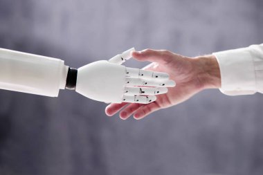 AI Robot Digital Machine And Man Hand Handshake