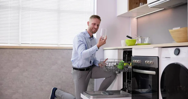 Young Man Taking Drinking Glass Dishwasher Kitchen — Stock Photo, Image