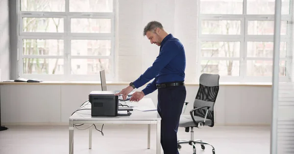Irritated Businessman Looking Paper Stuck Printer Office — Stock Photo, Image