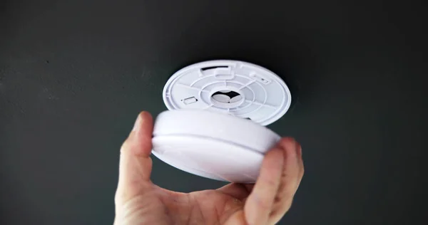 Person Hand Installing Smoke Detector Ceiling Wall Home — Stock Photo, Image