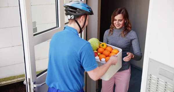 Delivery Man Giving Grocery Plastic Box Woman — Stock Photo, Image