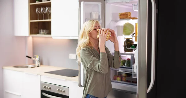 Young Woman Eating Sandwich Front Refrigerator — Stock Photo, Image