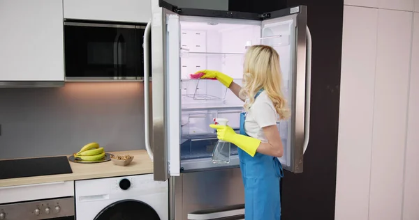 Young Smiling Professional Cleaning Service Woman Cleaning Refrigerator Kitchen — Stock Photo, Image