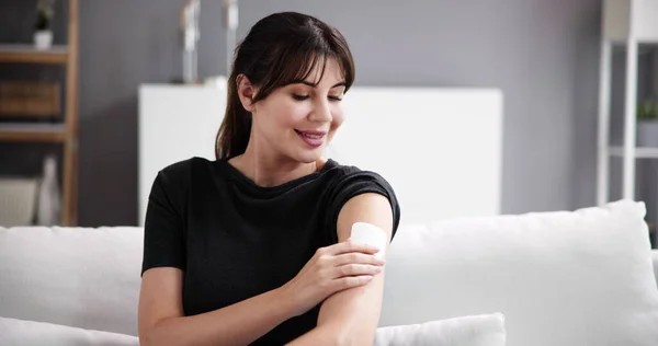 Woman With Contraception Patch Treatment On Arm
