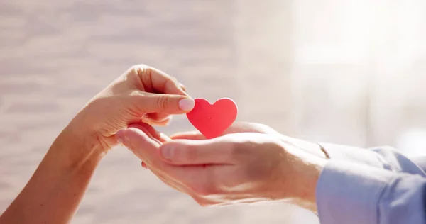 Close Woman Giving Red Heart Man Hand — Stock Photo, Image