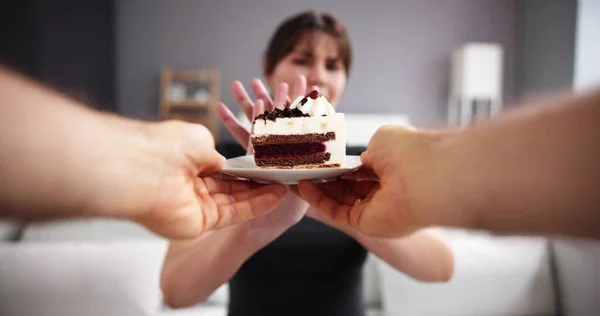 Woman Refusing Slice Delicious Cake Offered Person — Stock Photo, Image