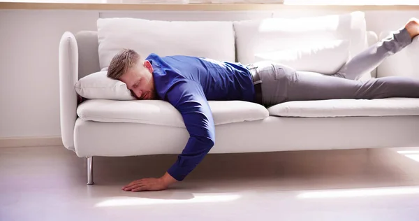 Exhausted Man Falling Asleep Couch Home — Stock Photo, Image