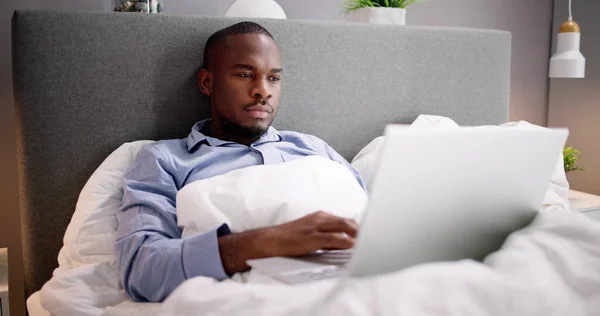 Happy Man Sitting Bed Using Laptop — Stock Photo, Image