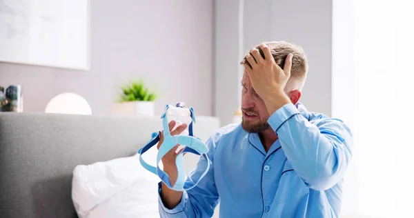 Shocked Young Man Holding Cpap Machine Mask — Stock Photo, Image